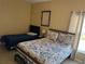 Comfortable bedroom featuring two beds, tile floors, neutral paint, and a ceiling fan at 708 Pincon Ln, Kissimmee, FL 34759