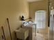 Bright laundry room featuring modern appliances, a utility sink, and ample shelving space at 708 Pincon Ln, Kissimmee, FL 34759