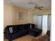 Relaxing secondary living area with a plush sectional sofa and neutral decor at 708 Pincon Ln, Kissimmee, FL 34759