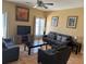 Cozy living room with tile floors, two sofas, two armchairs, and plenty of light at 708 Pincon Ln, Kissimmee, FL 34759
