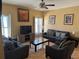 Comfortable living room with tile floors, two sofas, two armchairs, and natural light at 708 Pincon Ln, Kissimmee, FL 34759