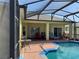 Outdoor living space with a covered patio and a sparkling pool at 708 Pincon Ln, Kissimmee, FL 34759
