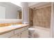 Bathroom featuring a shower-tub combination, a tile backsplash and a vanity sink at 7333 Radiant Cir, Orlando, FL 32810
