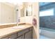 Neutral bathroom featuring a single sink vanity, and a tiled shower/tub combination at 7333 Radiant Cir, Orlando, FL 32810