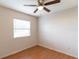 Bright bedroom with natural light, hardwood floors, and a ceiling fan at 7333 Radiant Cir, Orlando, FL 32810