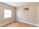 Bedroom with wood laminate flooring and a window air conditioning unit at 7333 Radiant Cir, Orlando, FL 32810