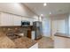 Modern kitchen with stainless steel appliances, granite countertops, tile backsplash, and ample cabinet space at 7333 Radiant Cir, Orlando, FL 32810