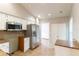 Bright kitchen features stainless steel appliances, granite counters, white cabinets, and plenty of storage at 7333 Radiant Cir, Orlando, FL 32810