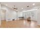 Spacious living room features hardwood floors, tall ceiling, and great natural light from large windows at 7333 Radiant Cir, Orlando, FL 32810