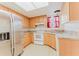 Modern kitchen featuring stainless steel appliances, wood cabinets, and a stainless steel refrigerator at 735 Baltimore Dr, Orlando, FL 32810