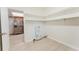 Bright and airy laundry room with tile floor, built-in shelves, and washer-dryer hookups at 735 Baltimore Dr, Orlando, FL 32810