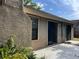 Exterior patio with sliding glass doors, window, and brick chimney at 840 Lake Jackson Cir, Apopka, FL 32703