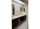 Bathroom with a double sink vanity, tile floors and mirrors at 840 Lake Jackson Cir, Apopka, FL 32703