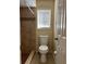 Bathroom featuring a tiled shower and a window for natural light at 840 Lake Jackson Cir, Apopka, FL 32703