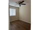 Bedroom featuring hardwood floors, a ceiling fan, and natural light from a window at 840 Lake Jackson Cir, Apopka, FL 32703