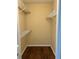 Walk-in closet with wood floors and metal shelving at 840 Lake Jackson Cir, Apopka, FL 32703