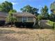 Side exterior view of home featuring well-maintained landscaping and clear windows at 840 Lake Jackson Cir, Apopka, FL 32703