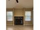 Living room featuring fireplace with tile surround and lots of natural light at 840 Lake Jackson Cir, Apopka, FL 32703