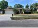 Charming single-story home with a well-manicured front yard and attached two-car garage at 840 Lake Jackson Cir, Apopka, FL 32703