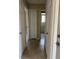 Hallway with doors leading to other rooms and tile floors at 840 Lake Jackson Cir, Apopka, FL 32703