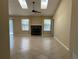 Bright living room featuring a fireplace, tile floors, and plenty of natural light at 840 Lake Jackson Cir, Apopka, FL 32703