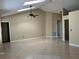 Spacious living room with high vaulted ceilings, tile floors, and natural light at 840 Lake Jackson Cir, Apopka, FL 32703