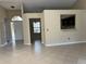 Open-concept living area with tile flooring, neutral tones, and lots of natural light at 840 Lake Jackson Cir, Apopka, FL 32703