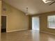 Spacious living room featuring tile flooring and natural light from sliding glass door and window at 840 Lake Jackson Cir, Apopka, FL 32703