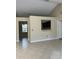 Open-concept living room with tile flooring, bright neutral walls and an open pass-through to the kitchen at 840 Lake Jackson Cir, Apopka, FL 32703