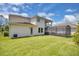 Spacious backyard with a screened-in patio and well-maintained lawn at 8768 Sonoma Coast Dr, Winter Garden, FL 34787