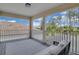 Covered balcony with gray outdoor rug and serene views of the neighborhood at 8768 Sonoma Coast Dr, Winter Garden, FL 34787