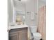 Bright bathroom with a modern vanity, toilet, and shower with patterned curtain at 8768 Sonoma Coast Dr, Winter Garden, FL 34787