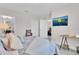 Comfortable bedroom with a TV, a stylish chair, and ample natural light at 8768 Sonoma Coast Dr, Winter Garden, FL 34787