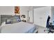 bedroom featuring a bed with Star Wars themed bedding, double closet, and wall decor at 8768 Sonoma Coast Dr, Winter Garden, FL 34787