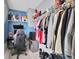Walk-in closet with organized clothing racks and shelving for personal items at 8768 Sonoma Coast Dr, Winter Garden, FL 34787