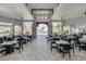 Elegant outdoor dining area with ample seating and stunning views of the pool at 8768 Sonoma Coast Dr, Winter Garden, FL 34787