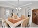 Bright dining room with a statement chandelier and neutral decor at 8768 Sonoma Coast Dr, Winter Garden, FL 34787