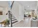 Inviting foyer with staircase leading to the upper level and an open floor plan at 8768 Sonoma Coast Dr, Winter Garden, FL 34787