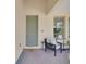 Inviting front porch with a welcome mat, seating, and decorative plants at 8768 Sonoma Coast Dr, Winter Garden, FL 34787