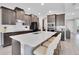 Contemporary kitchen with a large island, stainless appliances, and sleek cabinetry for ample storage at 8768 Sonoma Coast Dr, Winter Garden, FL 34787