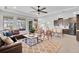 Spacious living room featuring an open-concept design, a ceiling fan, and tile flooring at 8768 Sonoma Coast Dr, Winter Garden, FL 34787