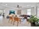 Comfortable living room with a ceiling fan and large windows for natural light at 8768 Sonoma Coast Dr, Winter Garden, FL 34787