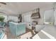 Outdoor kitchen featuring tile counters, stainless steel appliances, and an outdoor seating area at 8768 Sonoma Coast Dr, Winter Garden, FL 34787