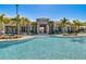 Resort-style pool and clubhouse with ample seating for poolside lounging, surrounded by lush landscaping at 8768 Sonoma Coast Dr, Winter Garden, FL 34787