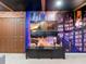 Finished basement area with a bookshelf mural, a media center, and other decor at 880 Paradise Dr, Davenport, FL 33897