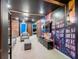 Finished basement area with brick accents, a bookshelf mural, and comfortable seating for a cozy entertainment space at 880 Paradise Dr, Davenport, FL 33897