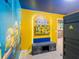 Bright and fun bedroom with Minion-themed decorations and an entertainment center at 880 Paradise Dr, Davenport, FL 33897