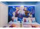 Charming bedroom with twin beds featuring Frozen-themed decor and a cozy atmosphere at 880 Paradise Dr, Davenport, FL 33897