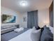 Comfortable bedroom features a large TV and decorative pillows at 880 Paradise Dr, Davenport, FL 33897