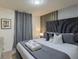 This bedroom features a luxurious bed with soft bedding and a unique headboard at 880 Paradise Dr, Davenport, FL 33897
